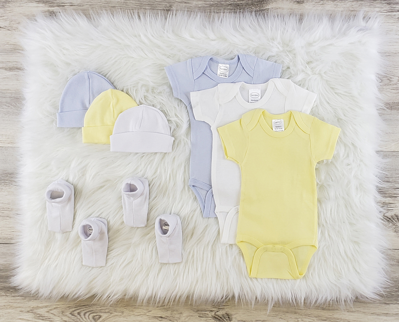 Bambini 8 Pc Layette Baby Clothes Set featuring soft cotton onesies, baby caps, and booties in various colors, perfect for newborns.