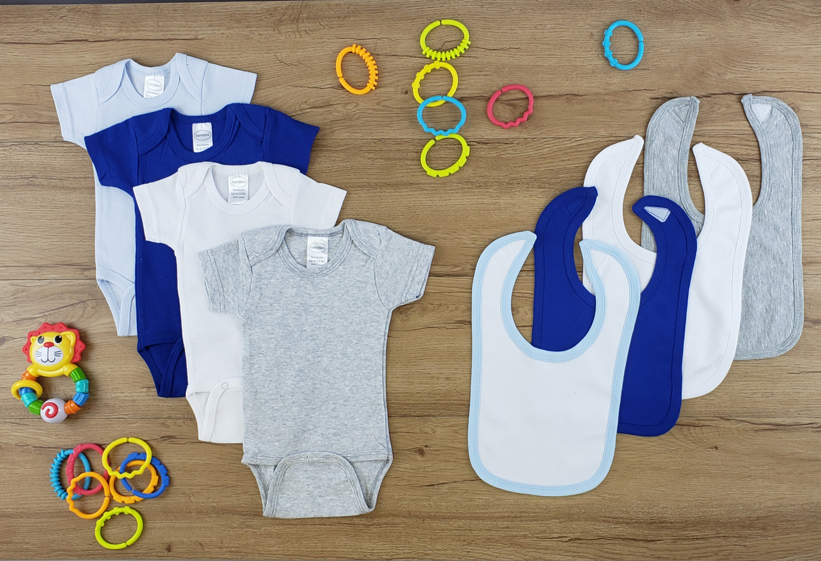 Bambini 8 Pc Layette Baby Clothes Set featuring soft cotton onesies and bibs in various colors, perfect for newborns.