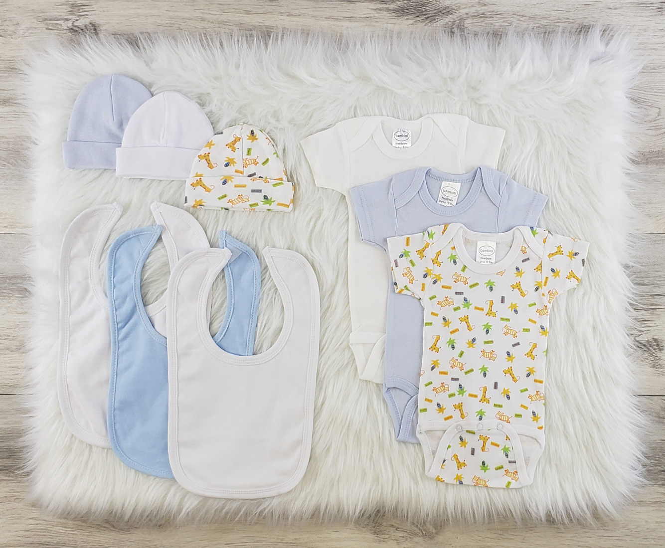 Bambini 9 Pc Layette Baby Clothes Set featuring soft cotton onesies, baby caps, and bibs in blue and white colors.