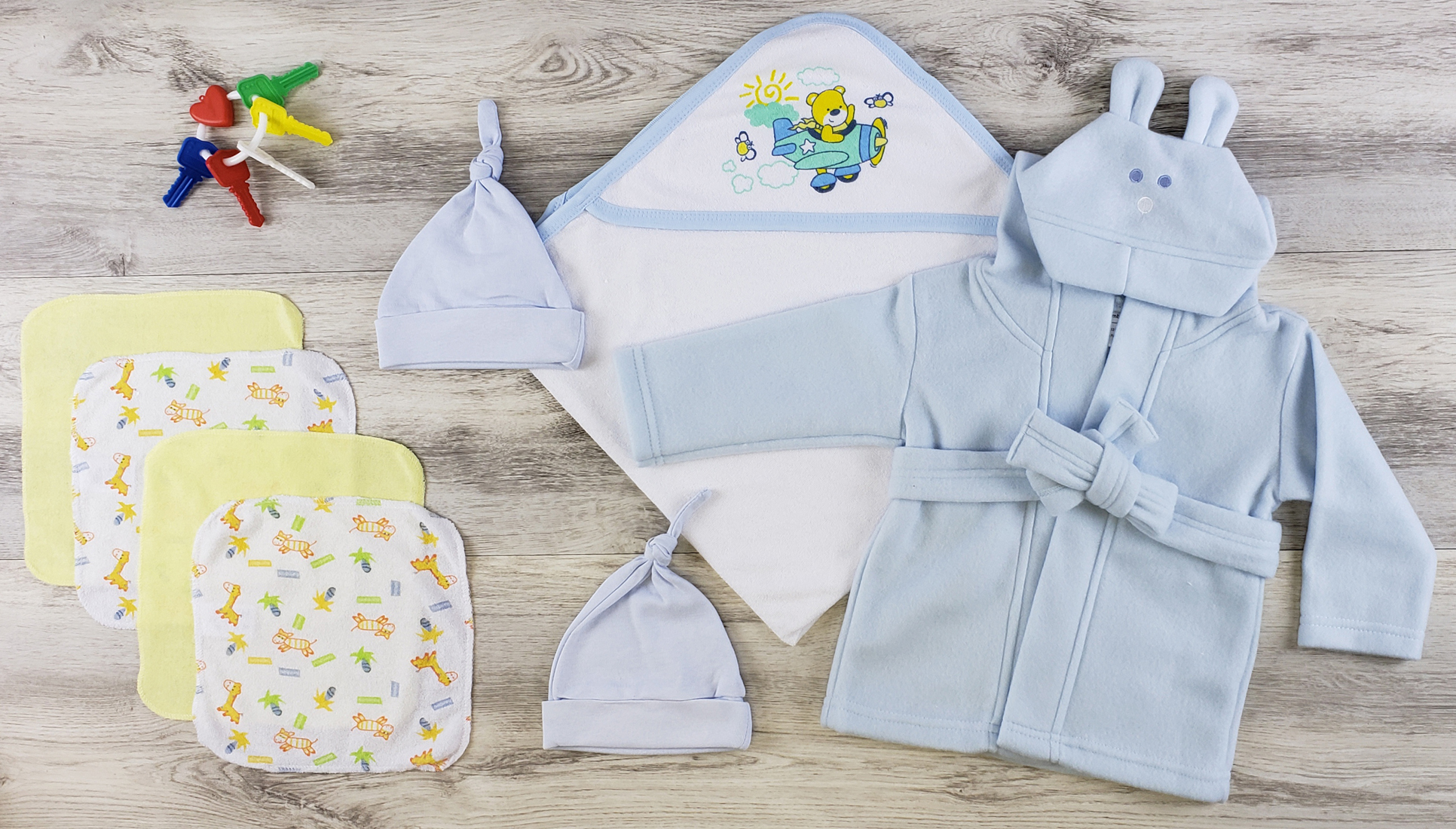 Bambini Hooded Towel set featuring soft cotton towel, blue knotted cap, and wash cloths, perfect for newborns.