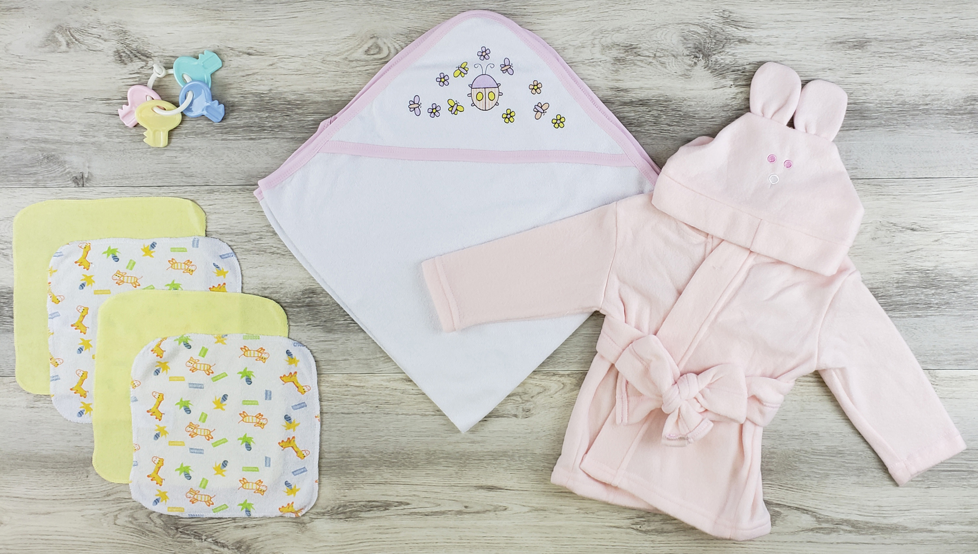 Bambini Hooded Towel, Wash Cloths, and Robe set featuring soft cotton fabric in pink, perfect for newborns.