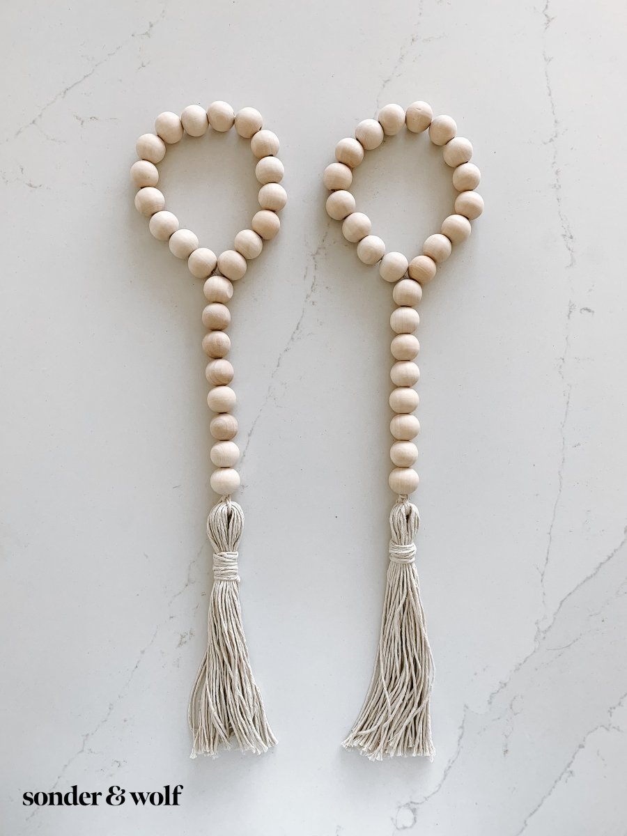 Set of 2 Beaded Loop Door Hangers featuring natural wooden beads and cotton tassels, perfect for home decor and gifting.