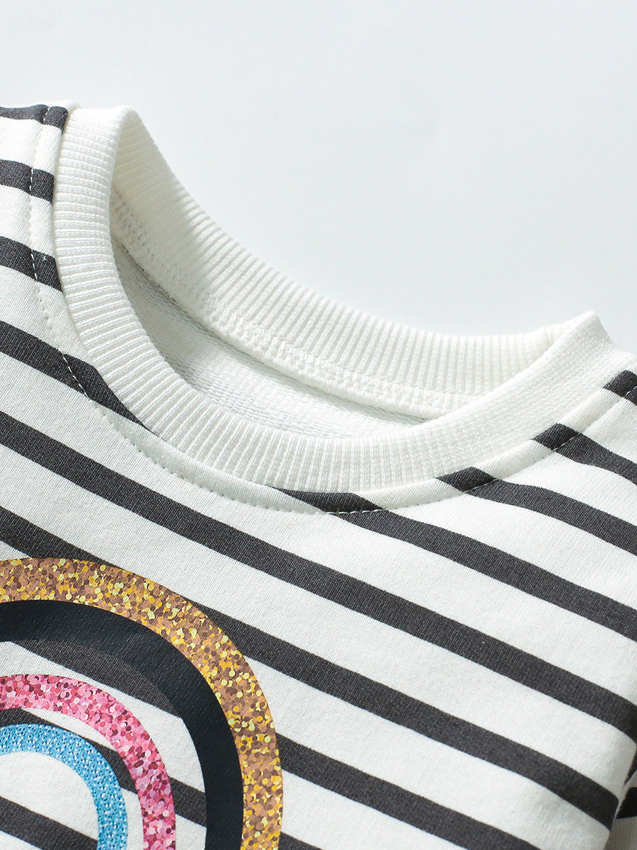 A stylish crew neck long sleeve top for girls featuring a vibrant rainbow and striped pattern, made from soft cotton material.