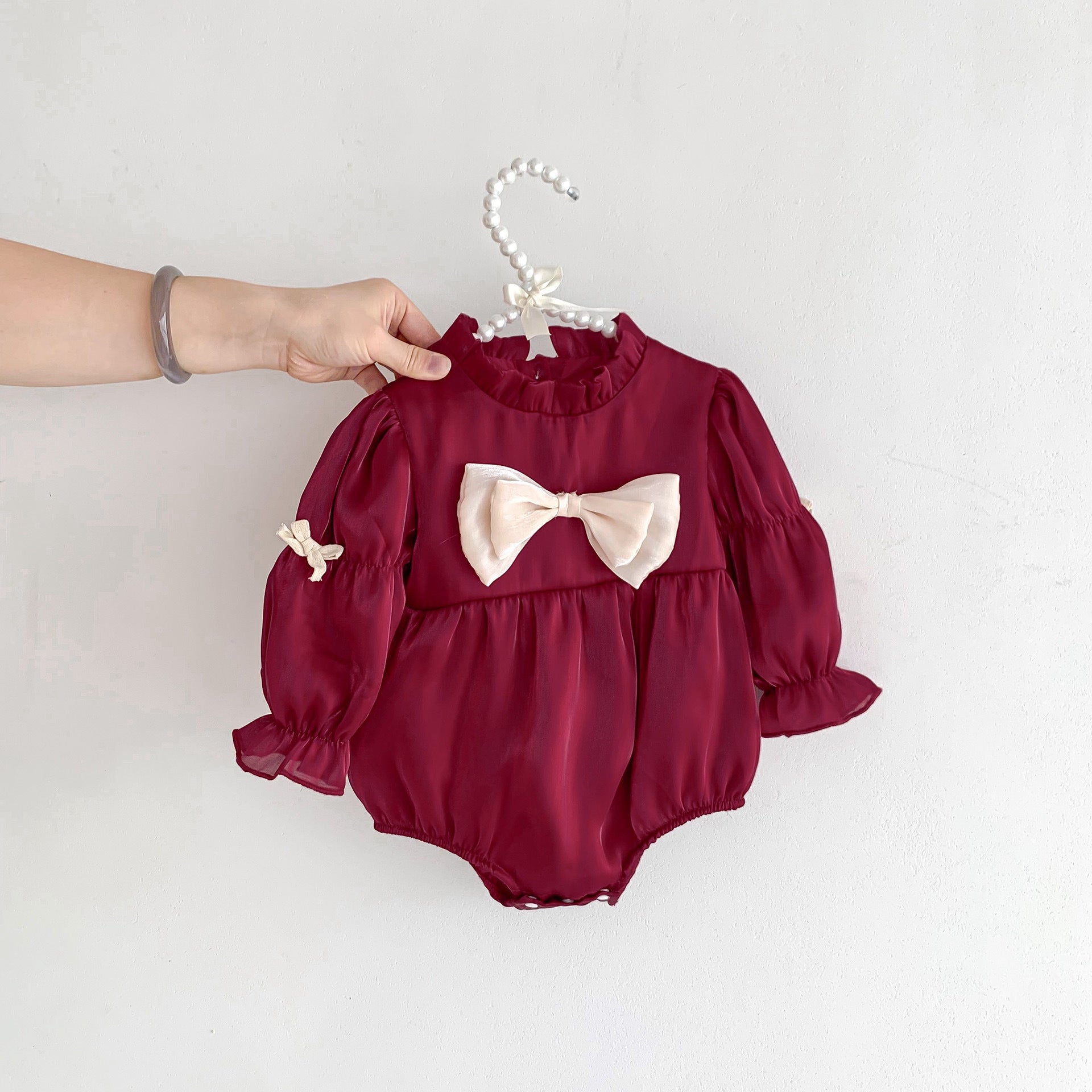 A stylish Birthday Red Mesh Patched Onesies Dress for baby girls, featuring a vibrant red color and soft cotton material with a mesh patch design.