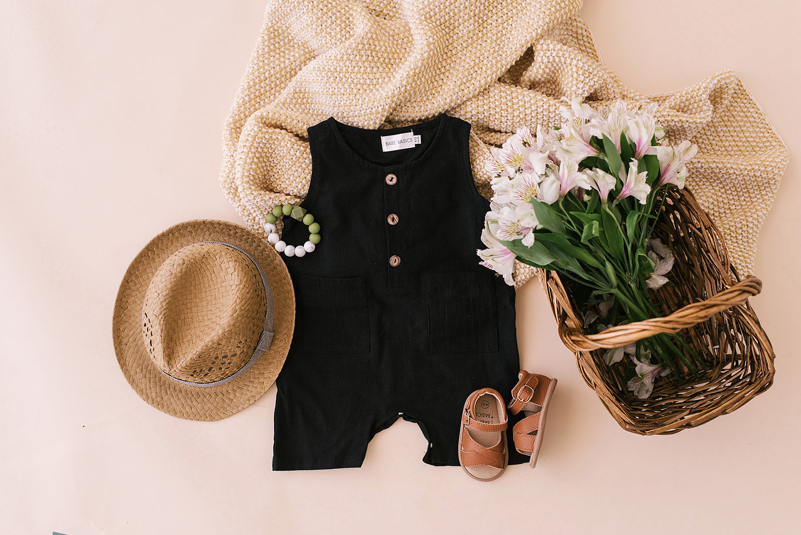 Black cropped linen baby romper with diaper snaps, stylish and breathable for summer wear.