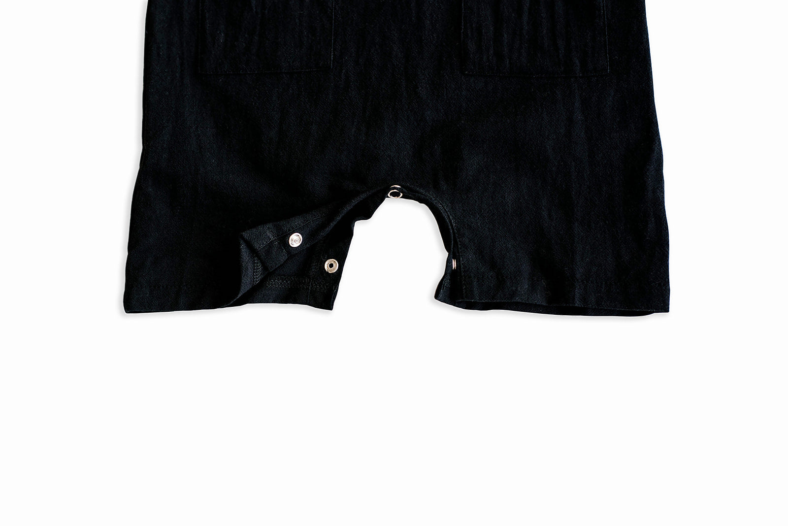 Black cropped linen baby romper with diaper snaps, stylish and breathable for summer wear.