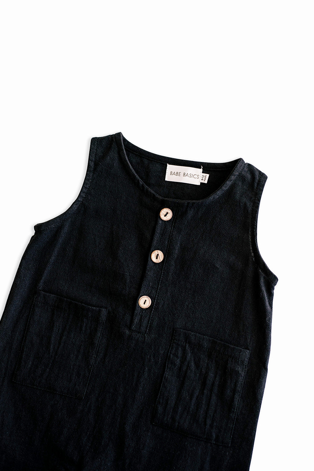 Black cropped linen baby romper with diaper snaps, stylish and breathable for summer wear.