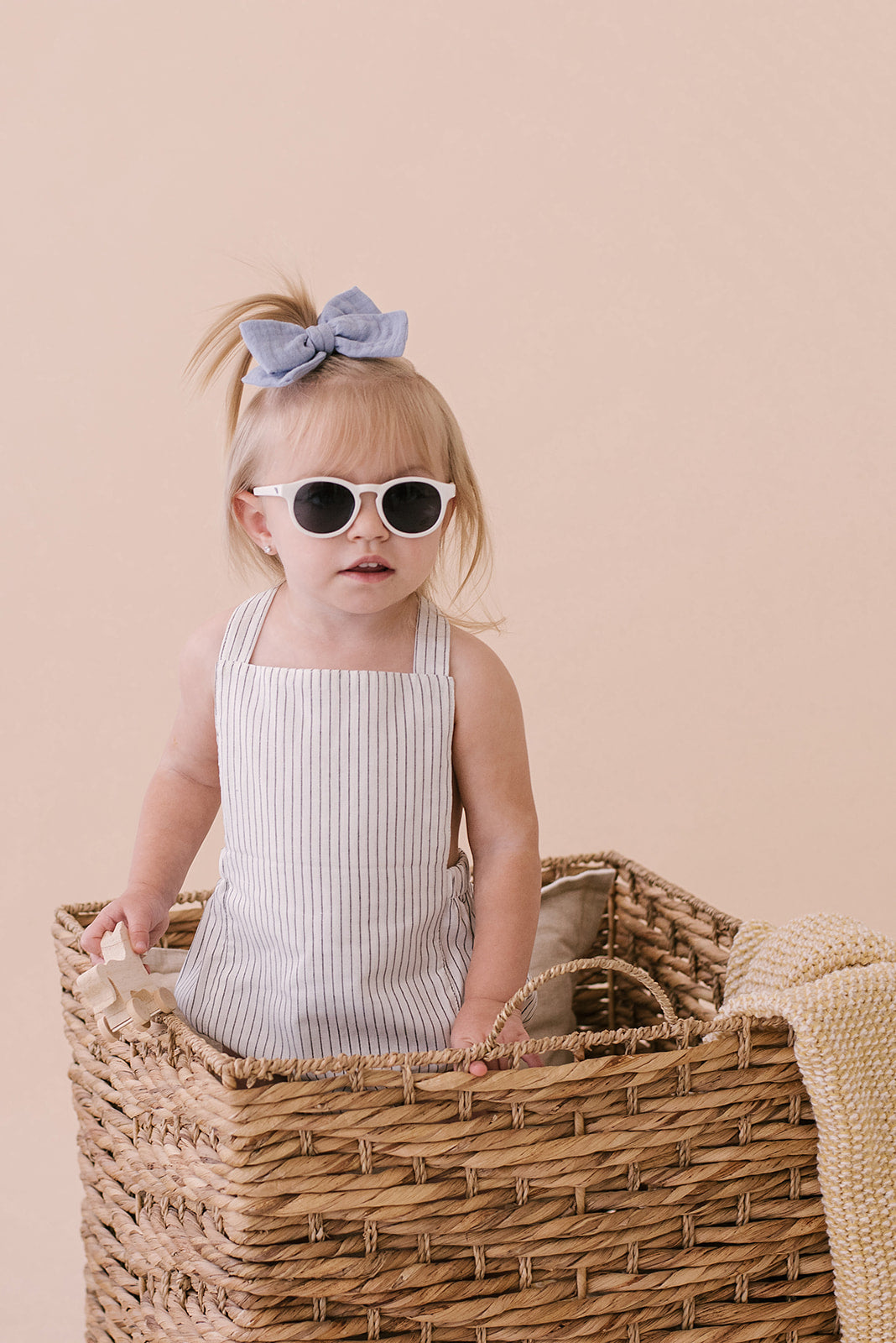 Black & White Striped Halter Romper for babies, featuring a stylish design with easy diaper snaps and made from soft linen fabric.