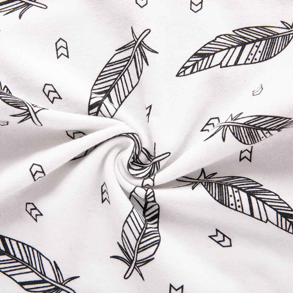 Black feather pattern on fabric.