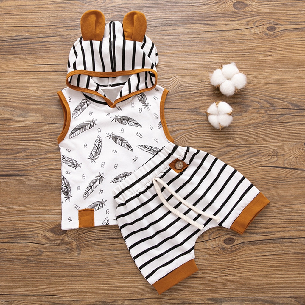 Striped baby outfit with feathers.