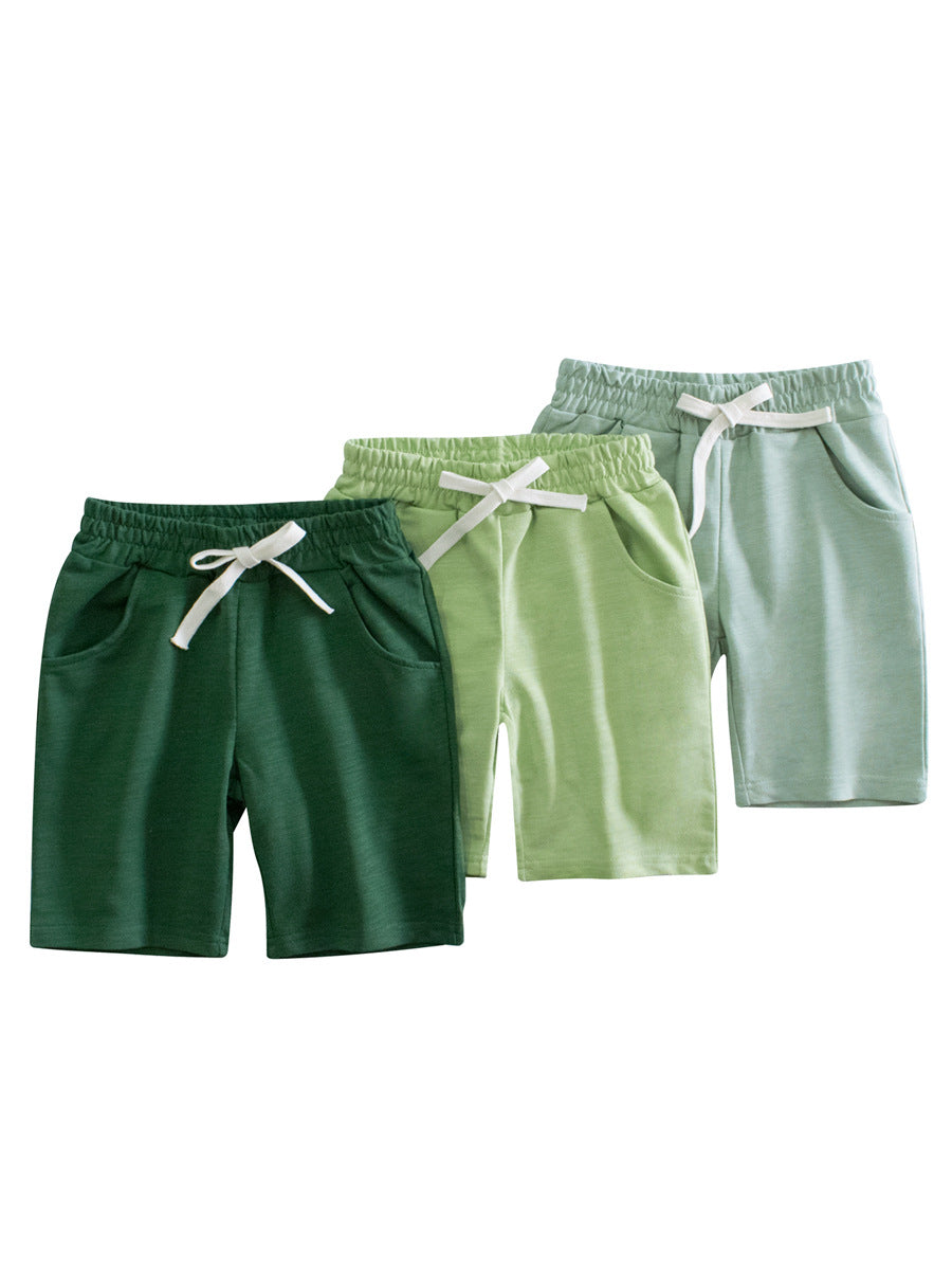 Boys solid color green soft casual style shorts made from cotton, perfect for summer wear, available in various sizes.