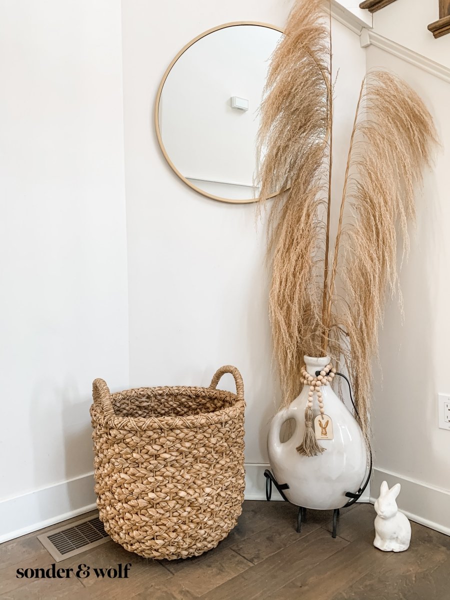 Bunny Wood Bead Garland featuring light wood beads and a jute tassel, perfect for home decor.