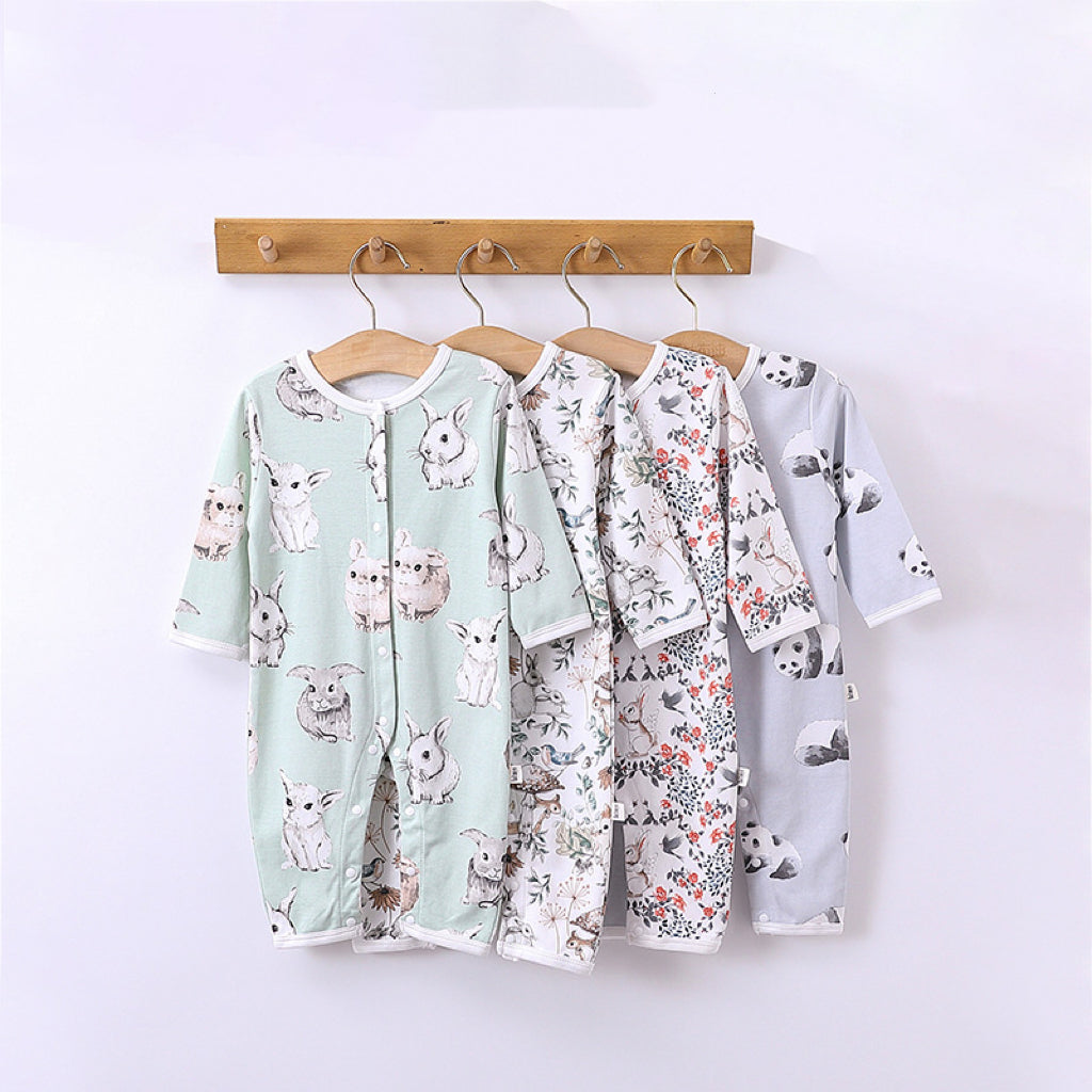 A collection of Cartoon Graphic Crewneck Comfy Rompers in various colors and playful designs for babies.