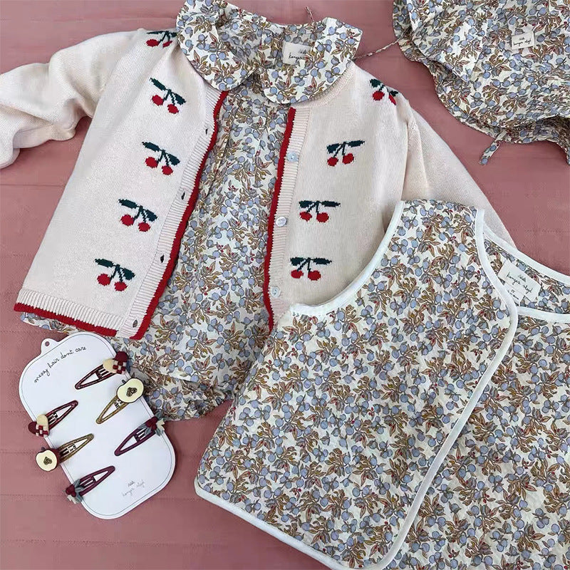 A beige cardigan for baby girls featuring cherry embroidery design, made from soft cotton material.