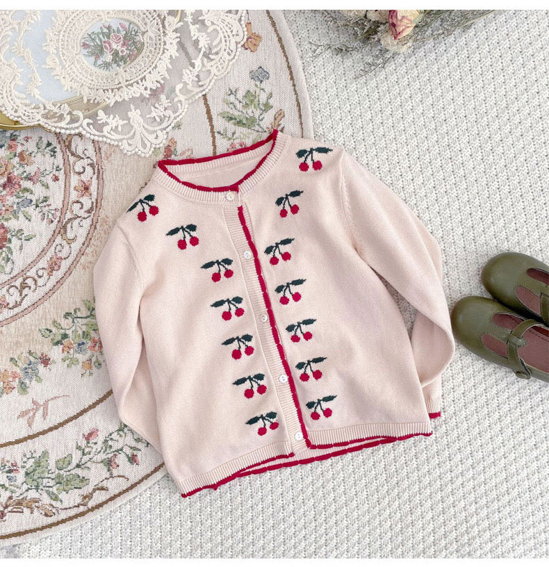 A beige cardigan for baby girls featuring cherry embroidery design, made from soft cotton material.