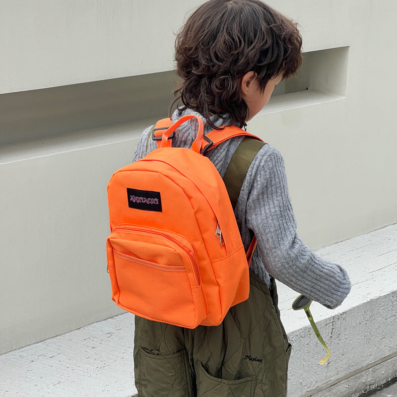 Children's lightweight canvas backpack in various colors, designed for ages 3-8, featuring a fun letters pattern.