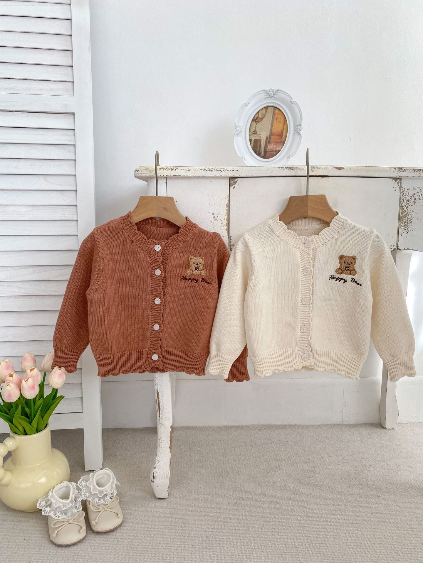 Children's knitted teddy bear cardigan in beige and brown, featuring an embroidered teddy bear design, perfect for spring wear.