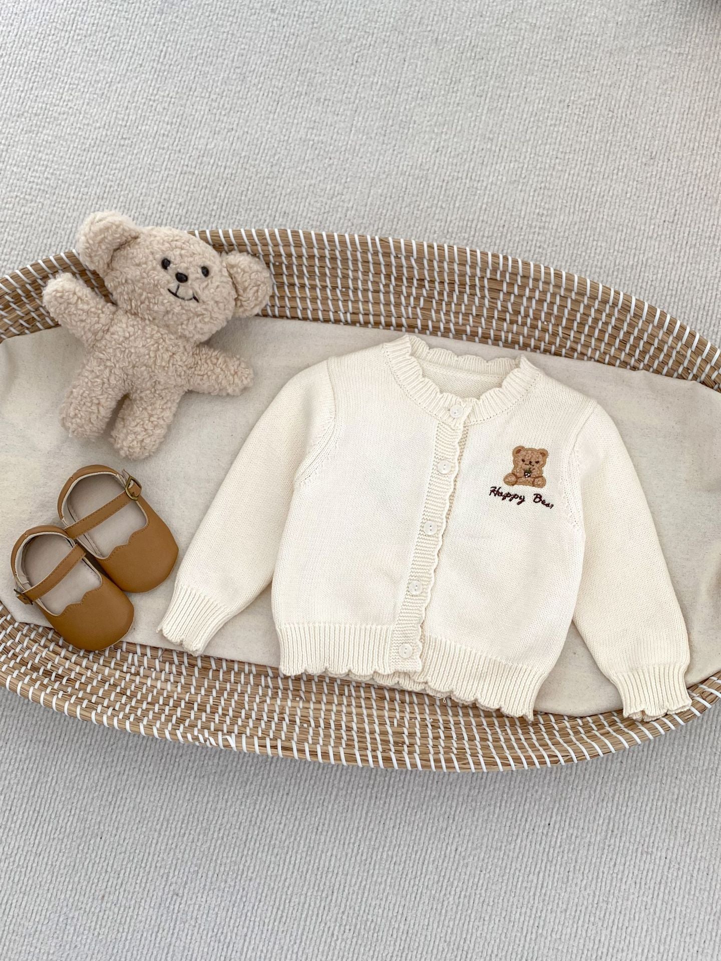 Children's knitted teddy bear cardigan in beige and brown, featuring an embroidered teddy bear design, perfect for spring wear.