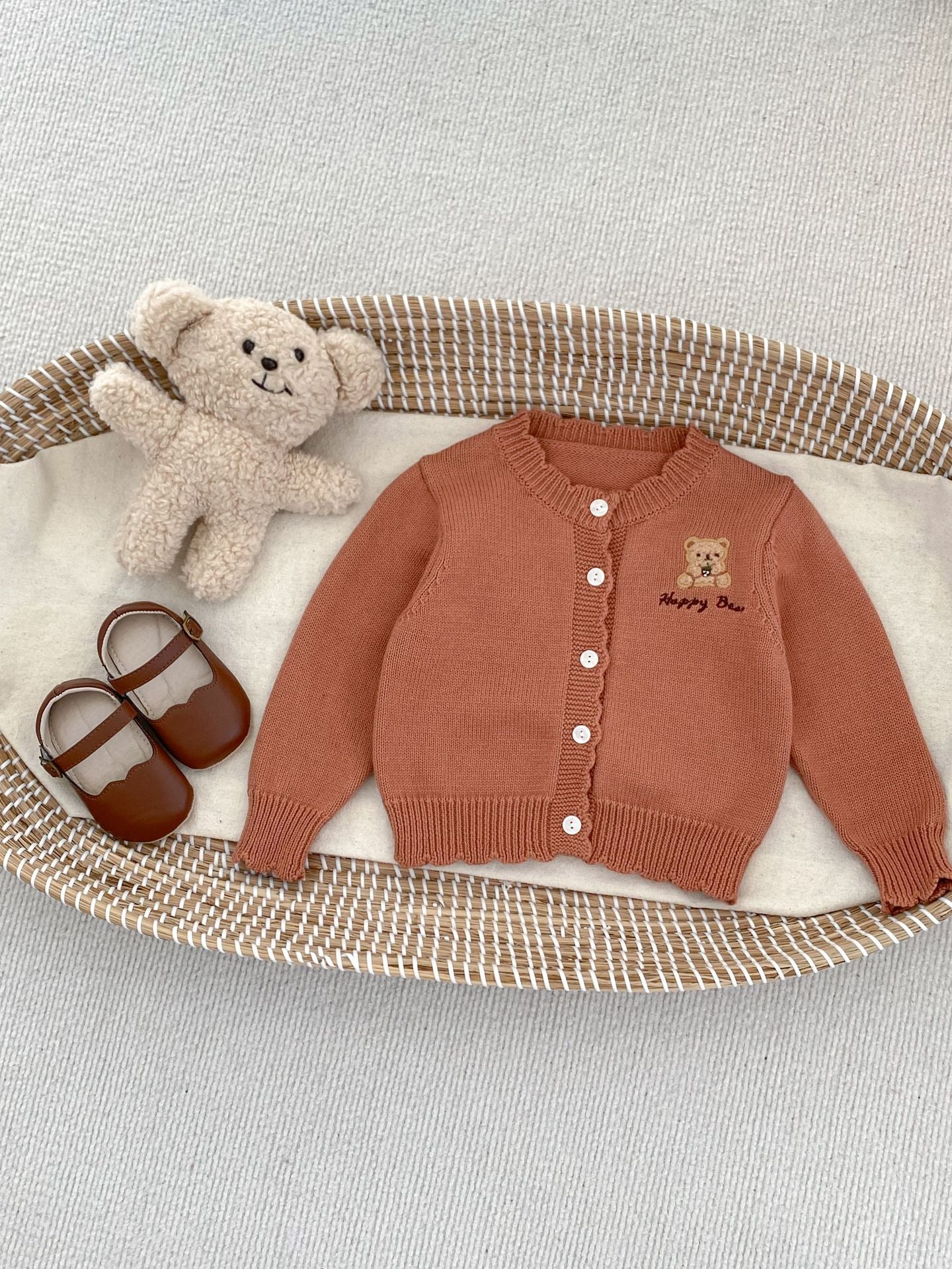 Children's knitted teddy bear cardigan in beige and brown, featuring an embroidered teddy bear design, perfect for spring wear.