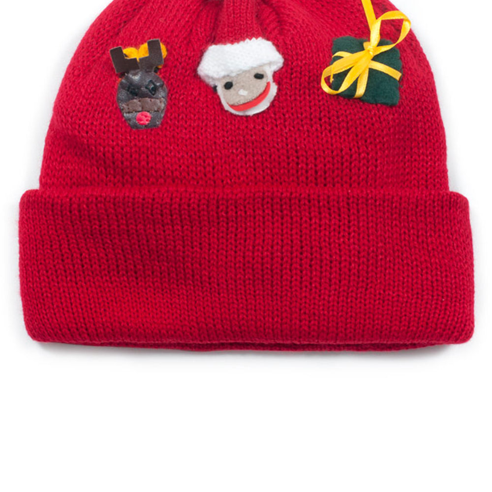 A cozy Christmas Knit Hat made from lightweight acrylic, featuring a festive design perfect for winter celebrations.