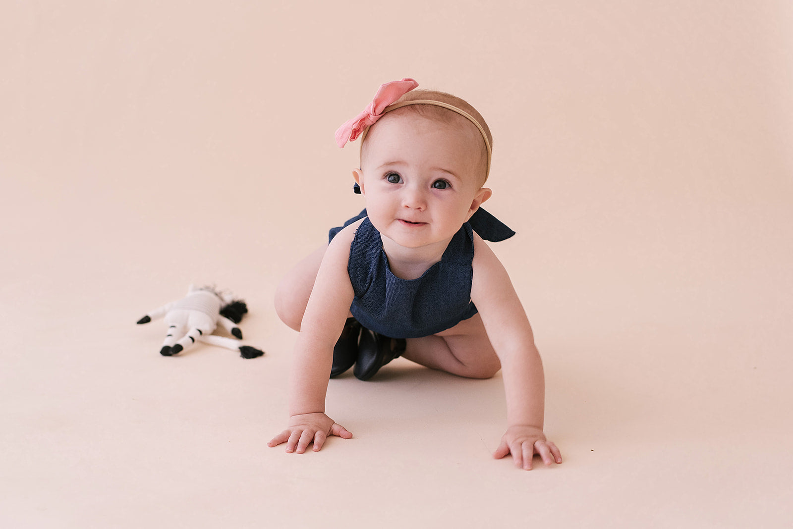 A stylish cobalt halter romper for babies, made from soft linen with diaper snaps.