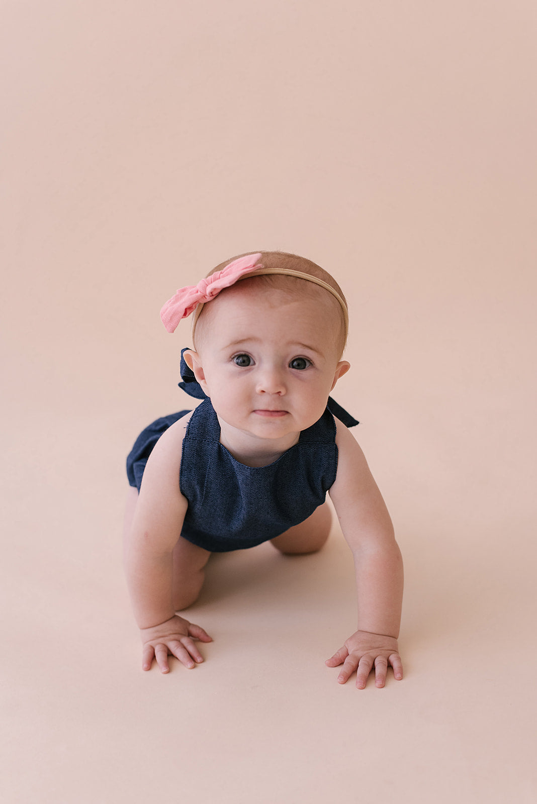 A stylish cobalt halter romper for babies, made from soft linen with diaper snaps.