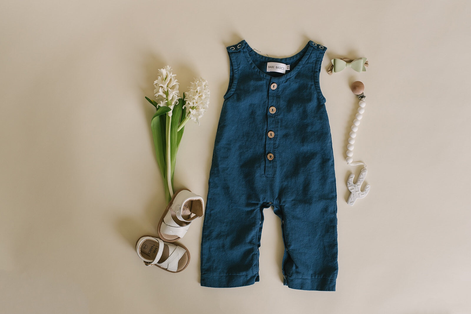 Cobalt Linen Basic Romper for babies, featuring diaper snaps and a stylish design, perfect for any occasion.