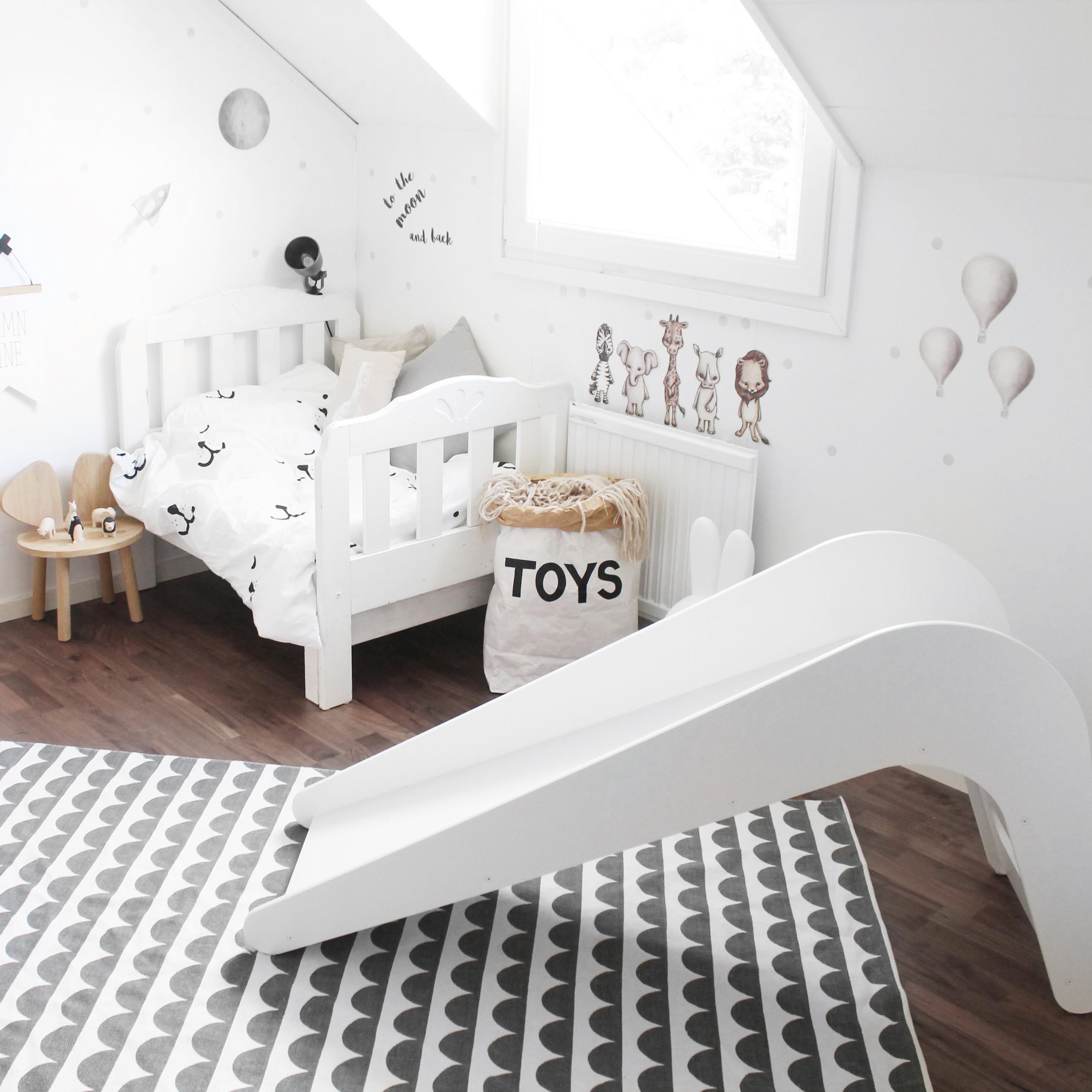 Timeless Pure Oak Handmade Slide in a stylish children's room, showcasing its elegant design and safe features for kids.