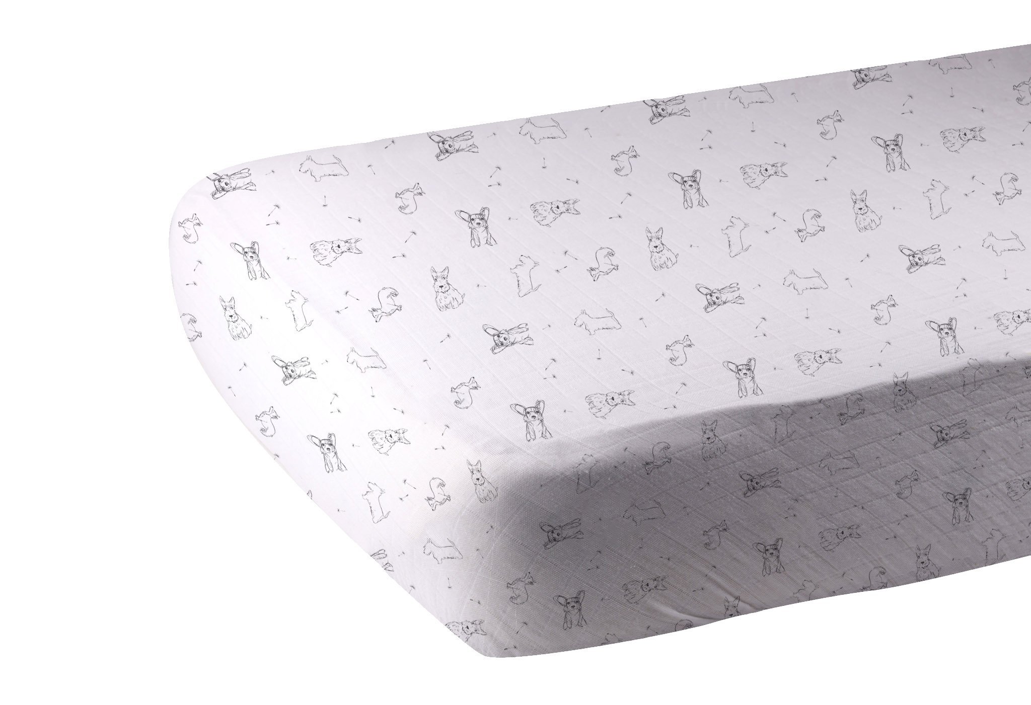 Corgi Bamboo Muslin Crib Sheet in a crib, showcasing its soft texture and breathable fabric.