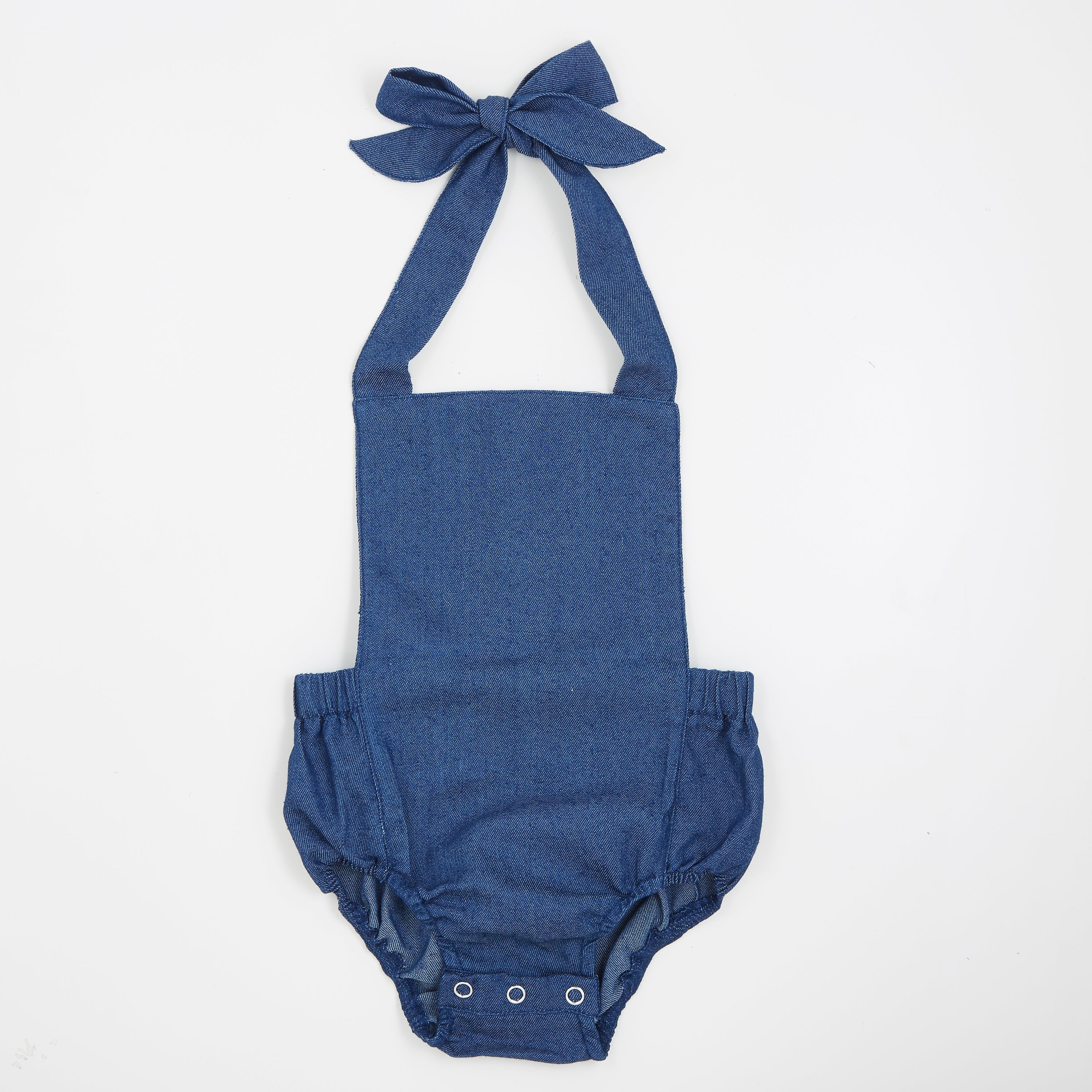 A stylish denim halter romper for babies, featuring easy diaper snaps and a trendy design, perfect for any occasion.