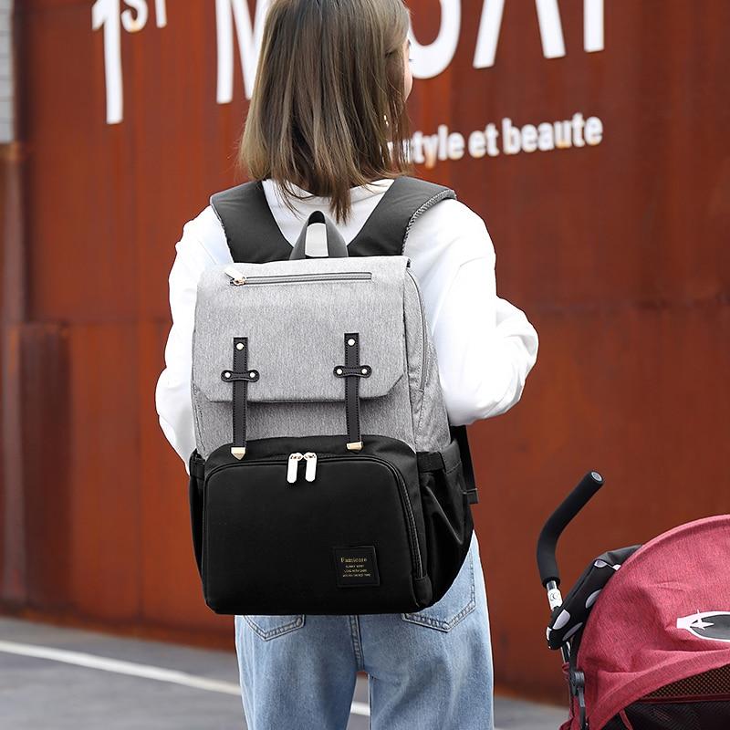 Stylish Diaper Bag Mummy Daddy Backpack in grey and black, featuring waterproof Oxford material and USB charging capability.