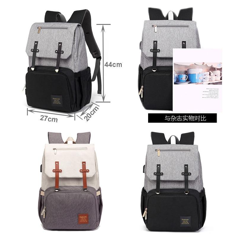 Stylish Diaper Bag Mummy Daddy Backpack in grey and black, featuring waterproof Oxford material and USB charging capability.