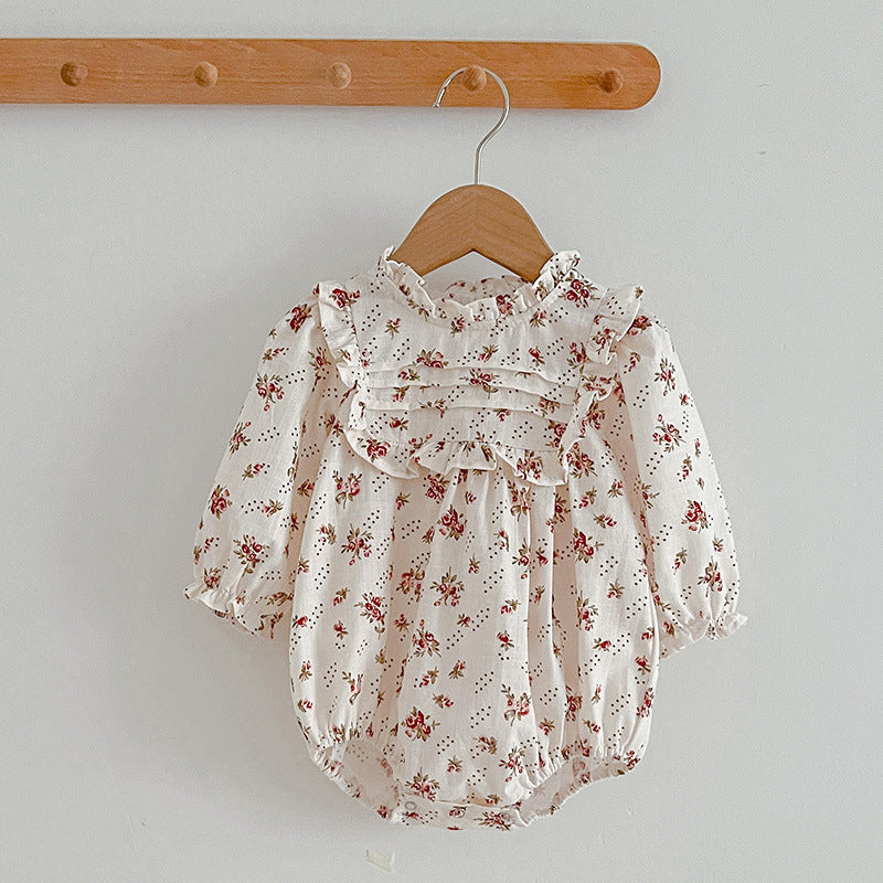 A collection of Ditsy Flower Graphic Sisterly Clothes, featuring floral onesies and dresses in white and red colors, made from soft cotton.