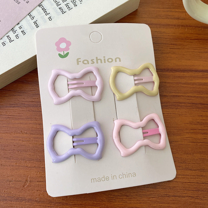 Enchanting Pink and Purple hair clip accessories for girls, featuring vibrant colors and a stylish design.