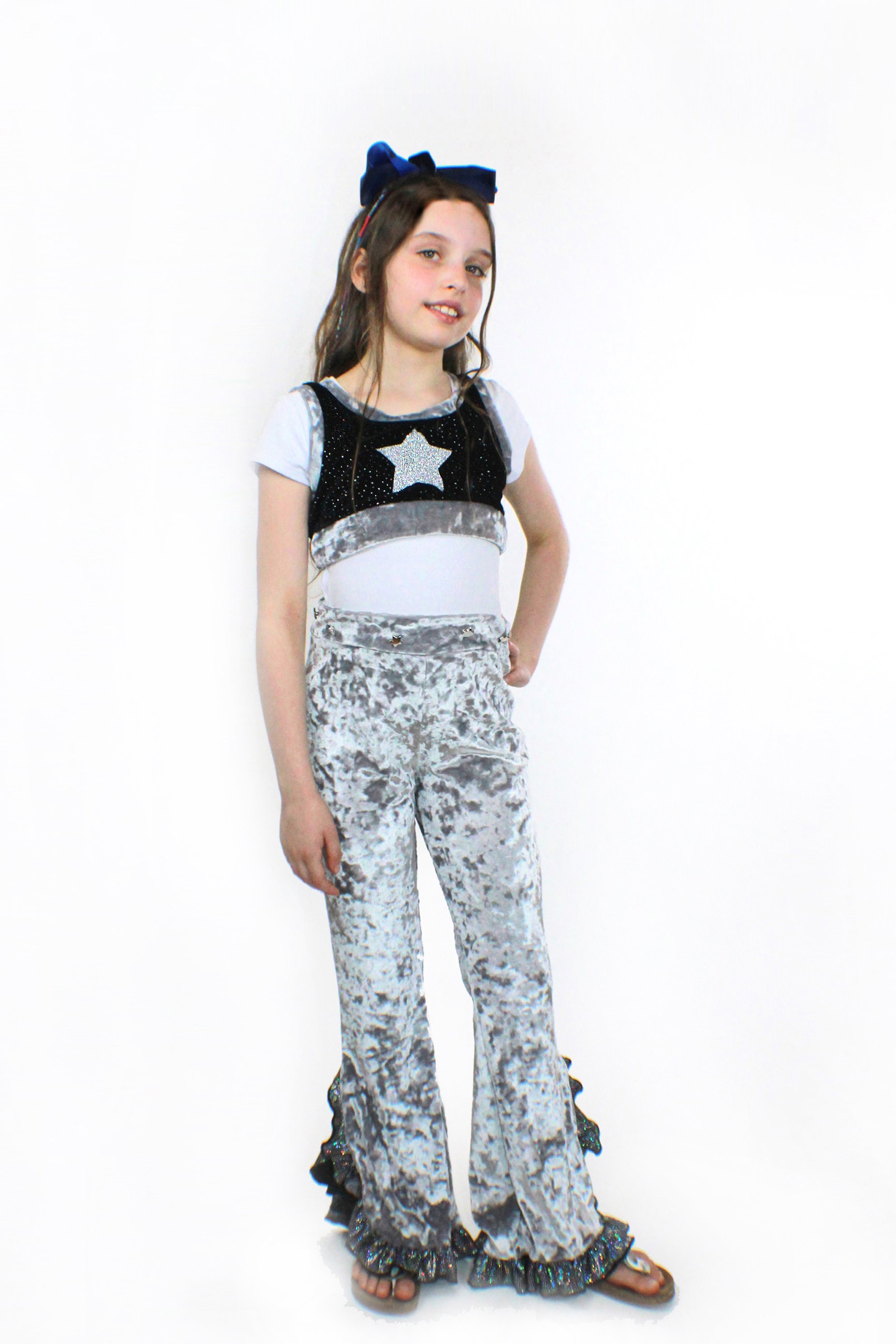 Eve silver crushed velvet flared pants with holographic sequin trim and knee-high slit, showcasing a stylish vintage look.