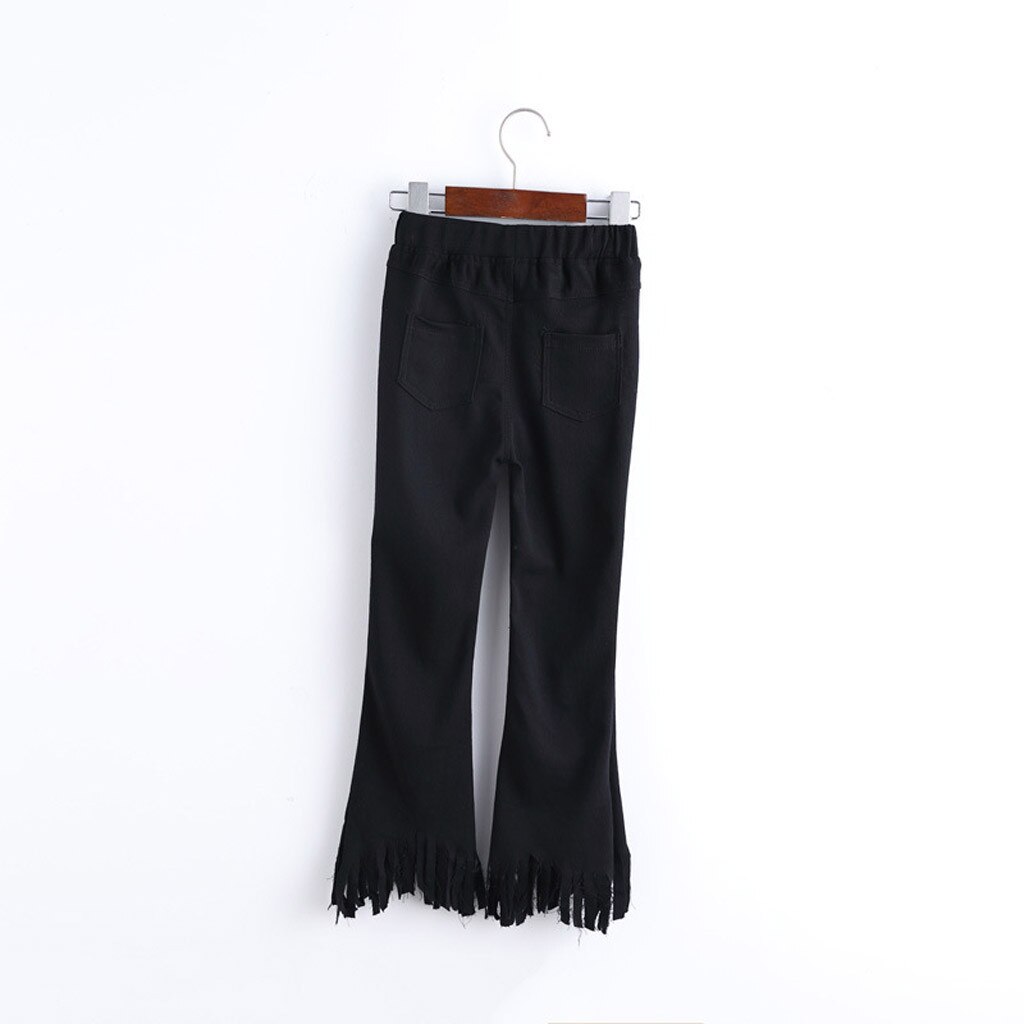 Black pants with jagged hem.