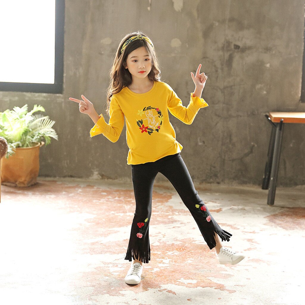 Young girl dancing in room.