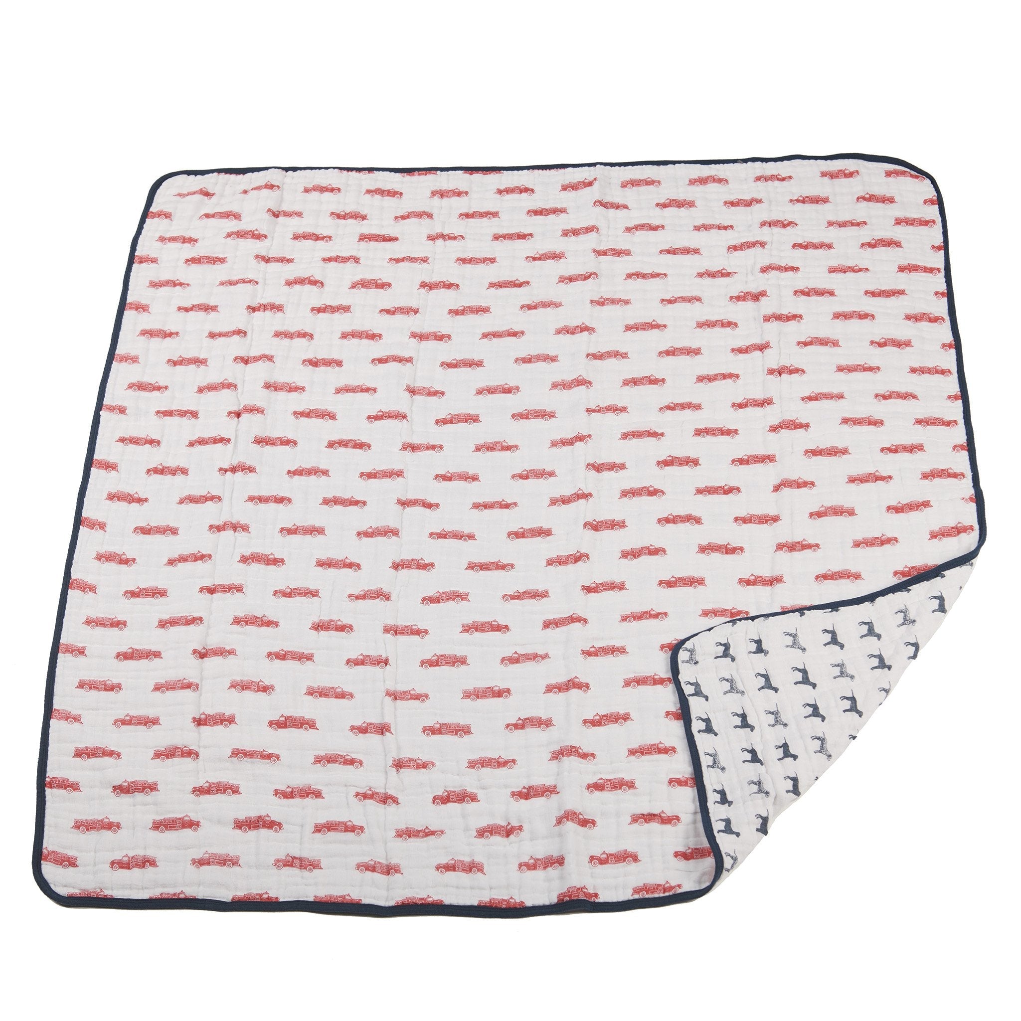 Cozy cotton muslin blanket featuring fire truck and Dalmatian designs, perfect for kids.