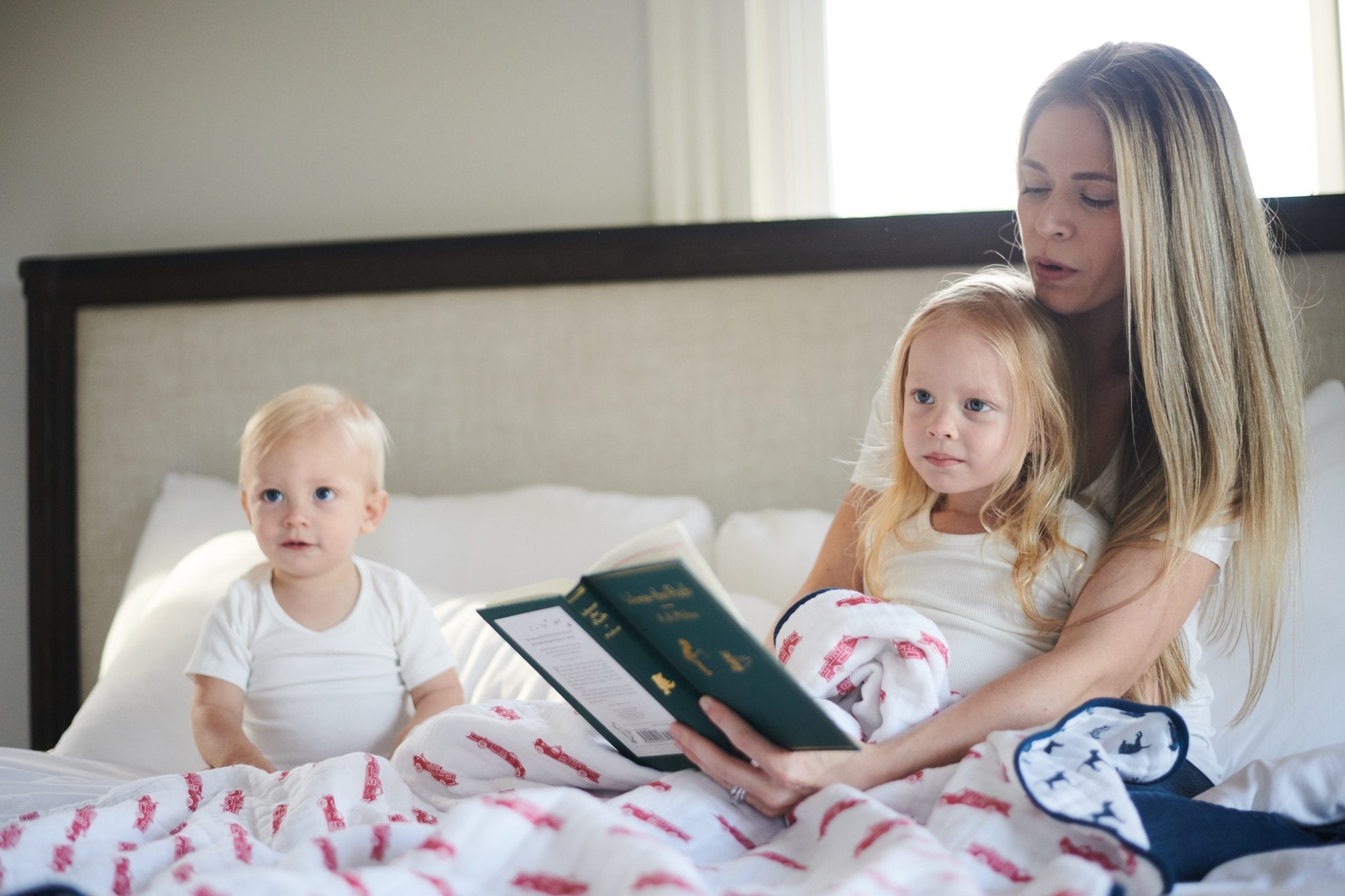 Cozy cotton muslin blanket featuring fire truck and Dalmatian designs, perfect for kids.