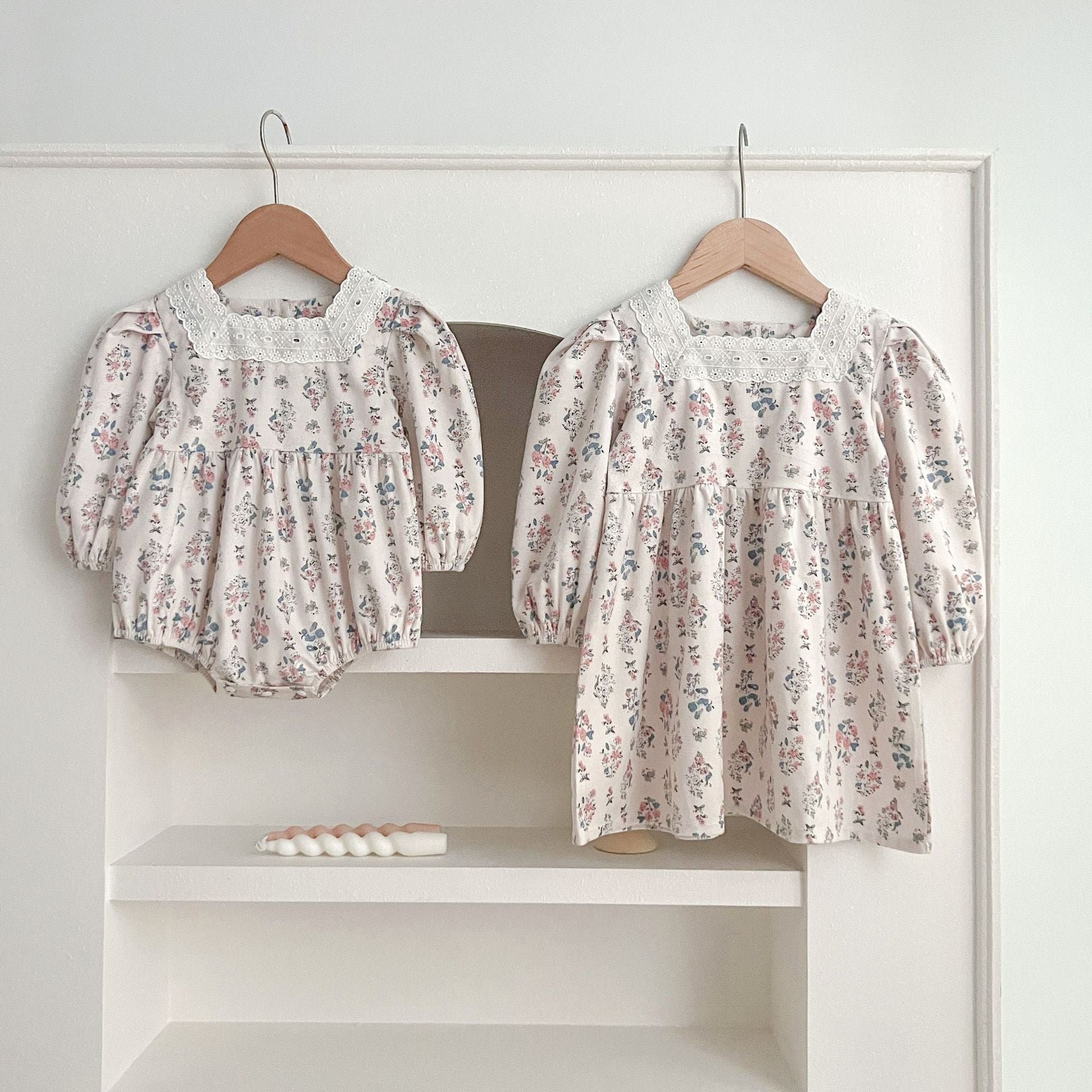 A cute Floral Square Neck Lantern Long Sleeve Onesie and Dress for baby girls, featuring a floral pattern in white and red colors.