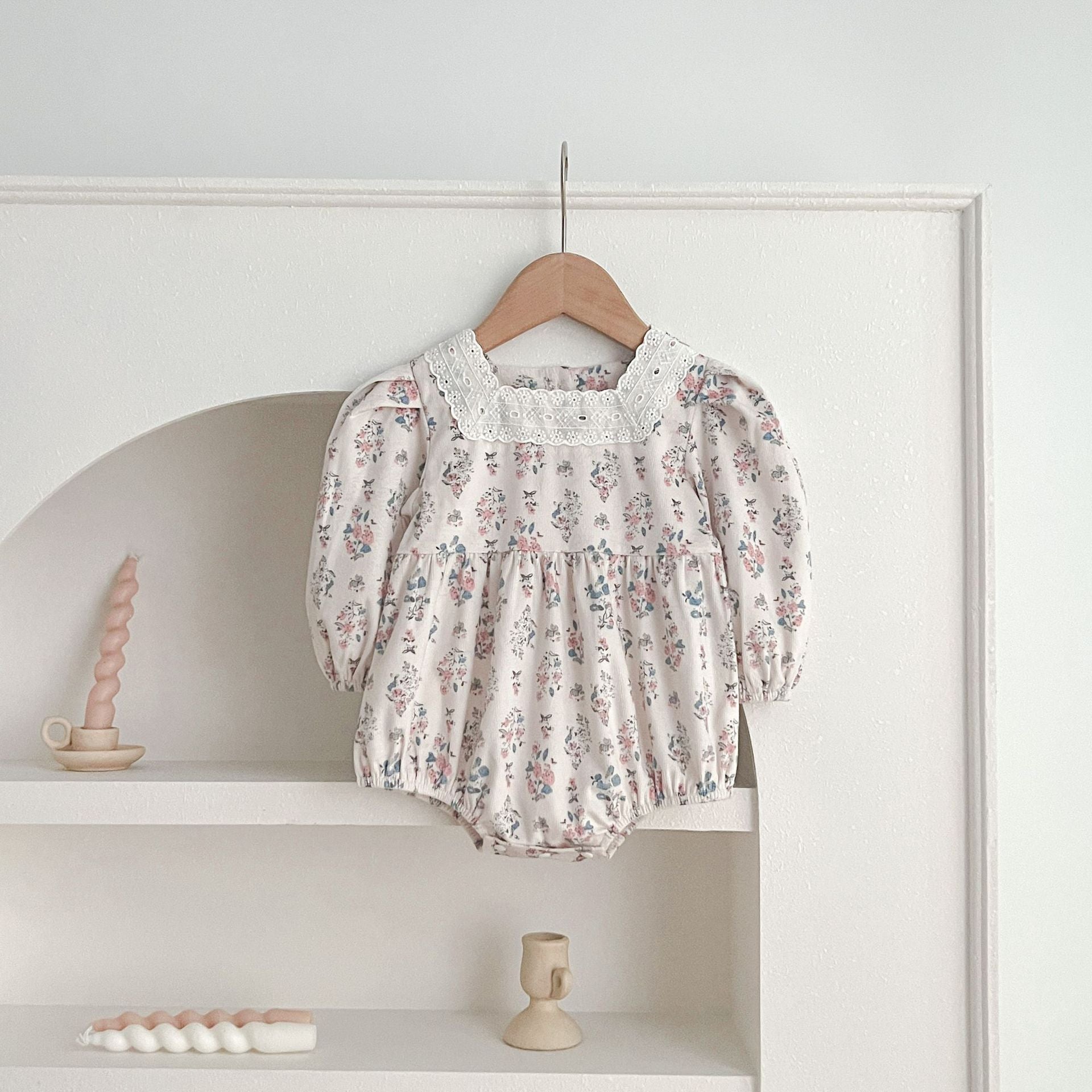 A cute Floral Square Neck Lantern Long Sleeve Onesie and Dress for baby girls, featuring a floral pattern in white and red colors.