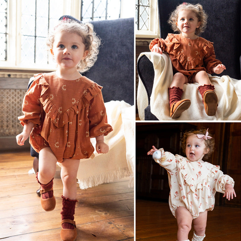 A cute vintage-style onesie for baby girls featuring a floral pattern in beige and brown colors, made from soft cotton fabric.