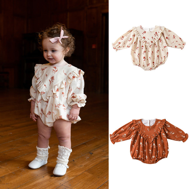 A cute vintage-style onesie for baby girls featuring a floral pattern in beige and brown colors, made from soft cotton fabric.