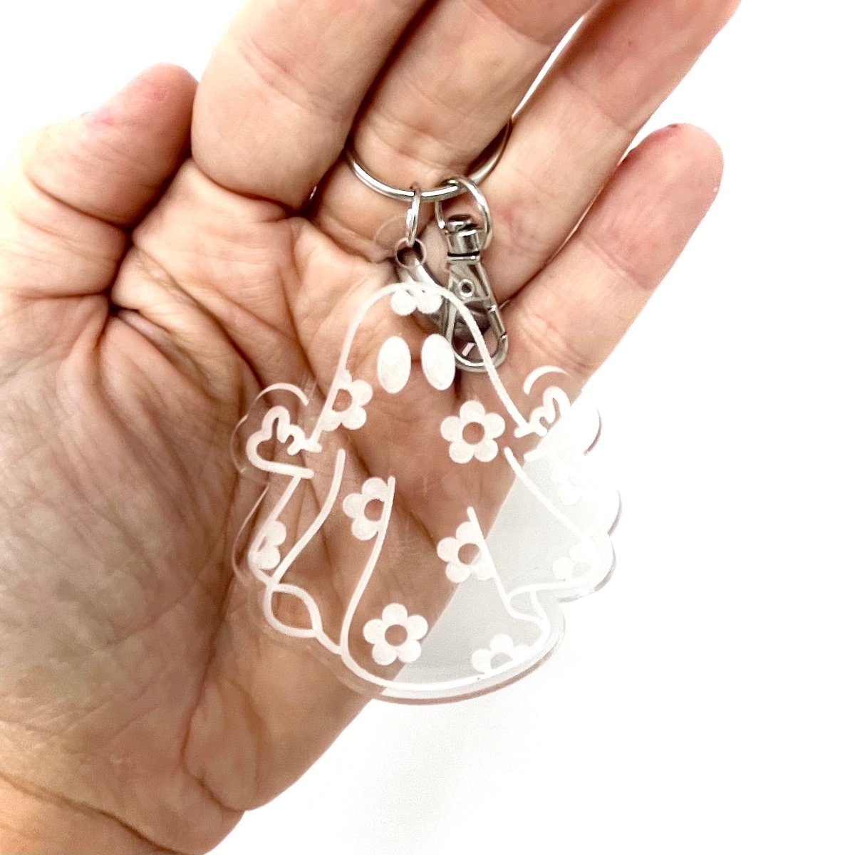 Daisy Ghost Keychain featuring a cute laser-engraved ghost design in clear acrylic, available in cute and sassy options.