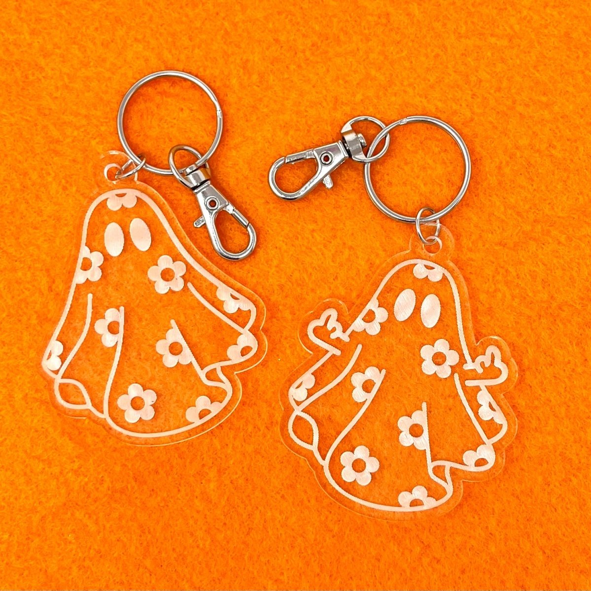 Daisy Ghost Keychain featuring a cute laser-engraved ghost design in clear acrylic, available in cute and sassy options.