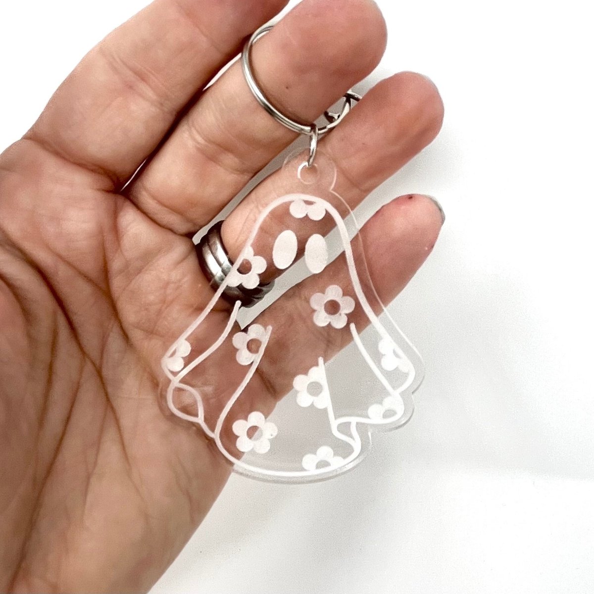 Daisy Ghost Keychain featuring a cute laser-engraved ghost design in clear acrylic, available in cute and sassy options.