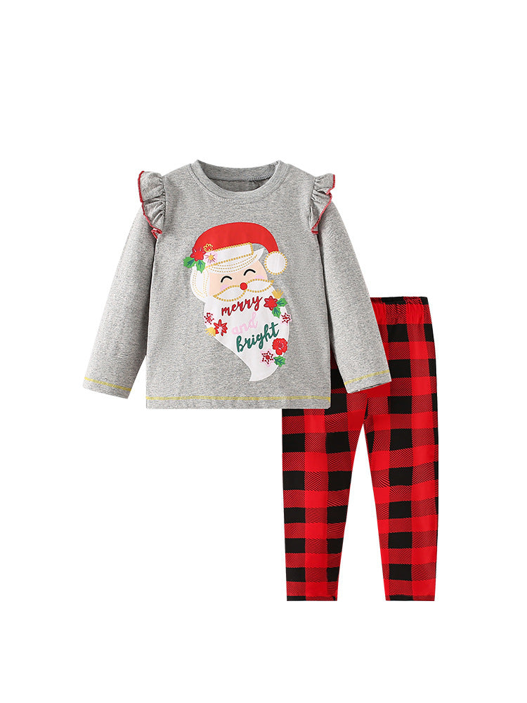 Girls Christmas outfit featuring a red cartoon top and plaid pants, perfect for festive occasions.