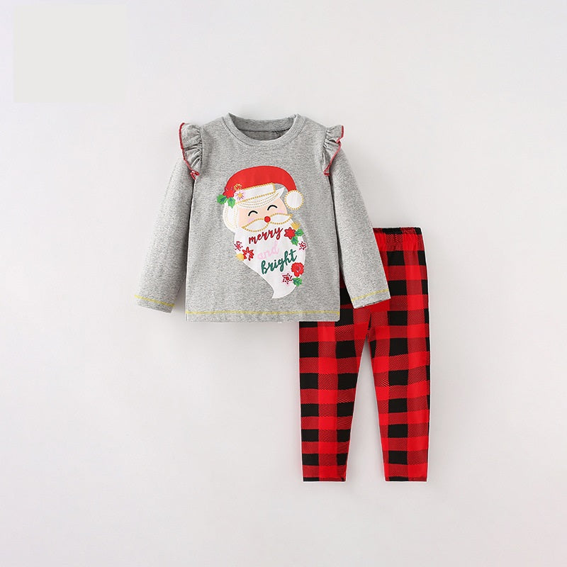 Girls Christmas outfit featuring a red cartoon top and plaid pants, perfect for festive occasions.