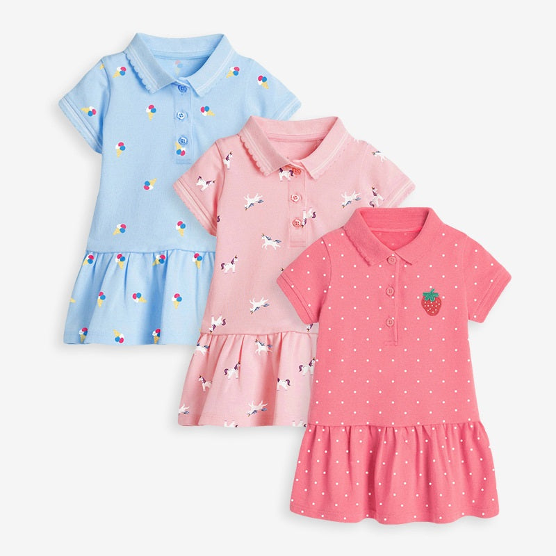 Girls’ Collar Flip Cartoon Children’s Polo Dress in red, pink, and blue colors, made from soft cotton, featuring a playful cartoon pattern.