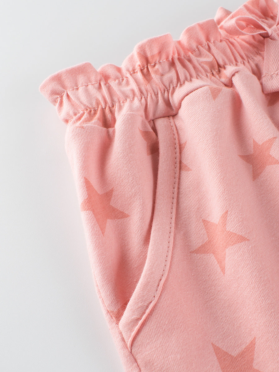 Girls pink casual shorts with stars print, made of soft cotton, perfect for summer wear.